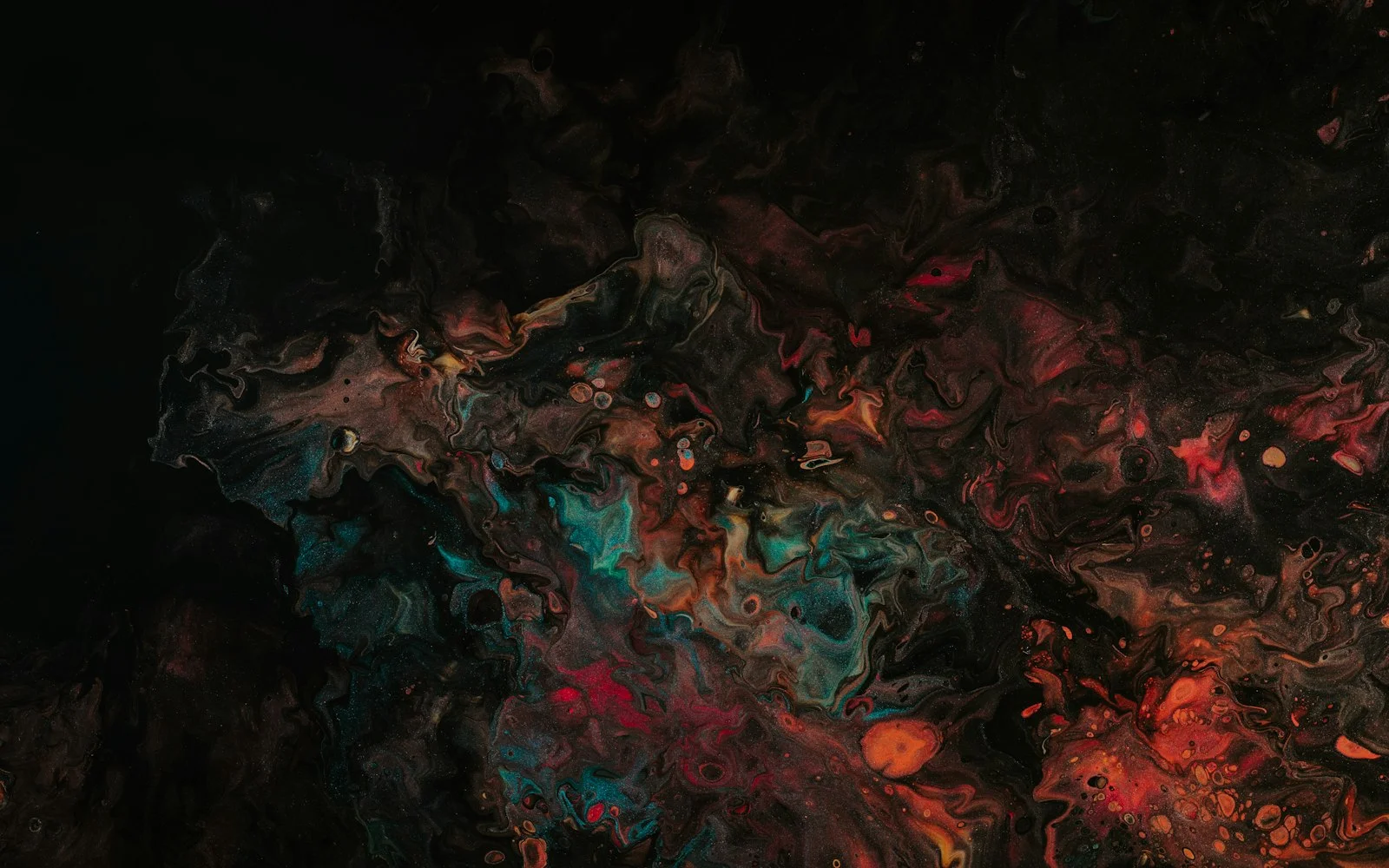 Marbled paint in teal, coral and cream pooling across a black field.
